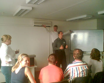 Тренинг в Москве. Сзади выступающего его ангел хранитель ;-)